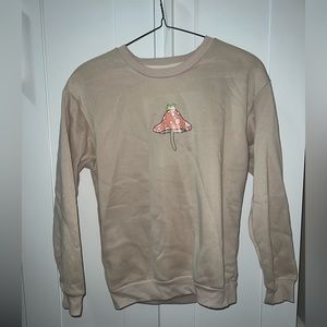 Tan Medium crewneck sweater with minimal design.